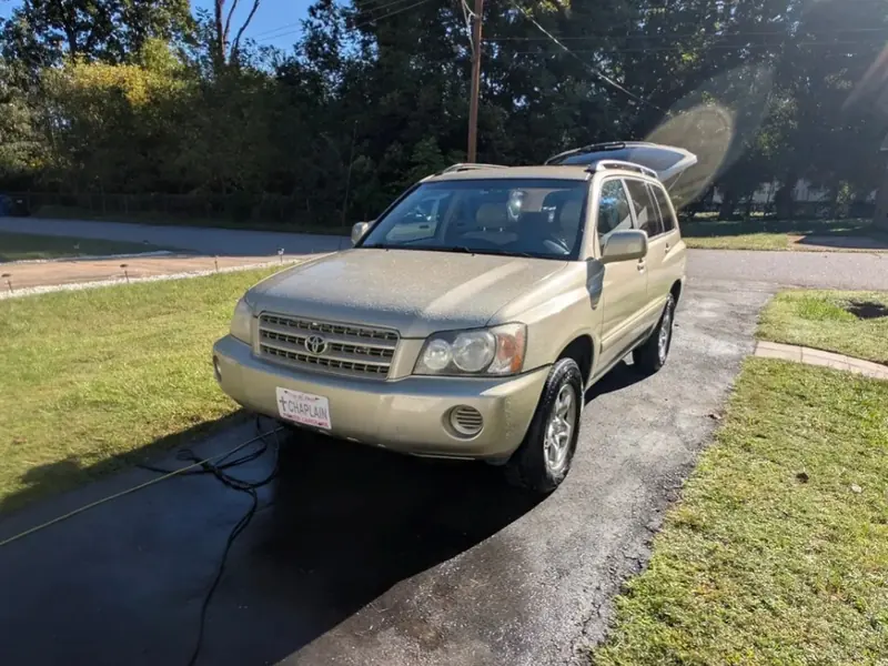Gold SUV rinsed and detailed in a Hickory driveway
