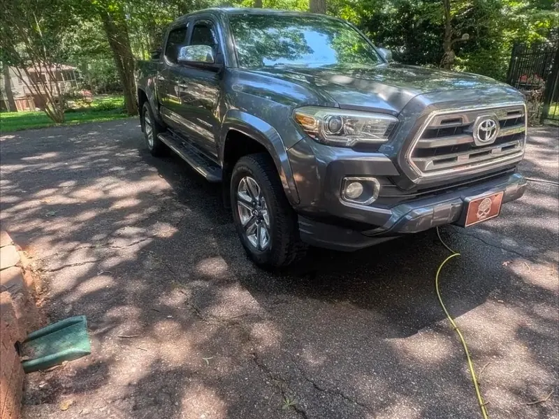 Gray Toyota Tacoma washed in a driveway