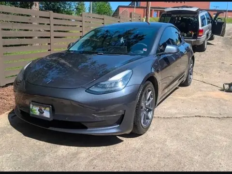 Gray Tesla Model 3 after a wash