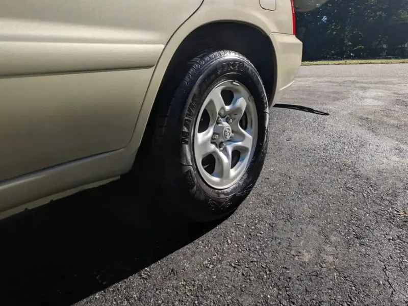 Close-up of a clean tire and wheel on a gold SUV