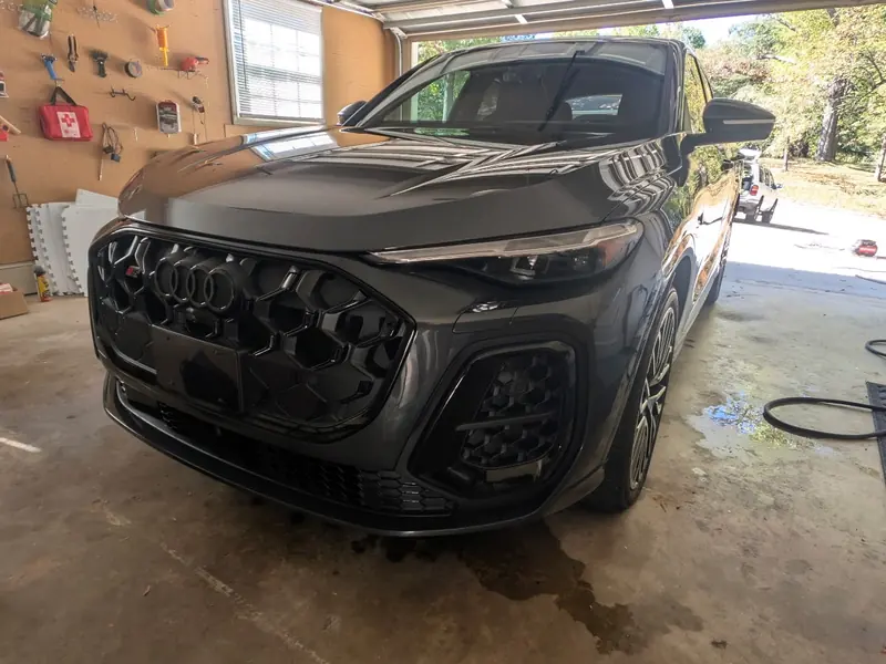 Dark gray SUV in a garage during a mobile detail