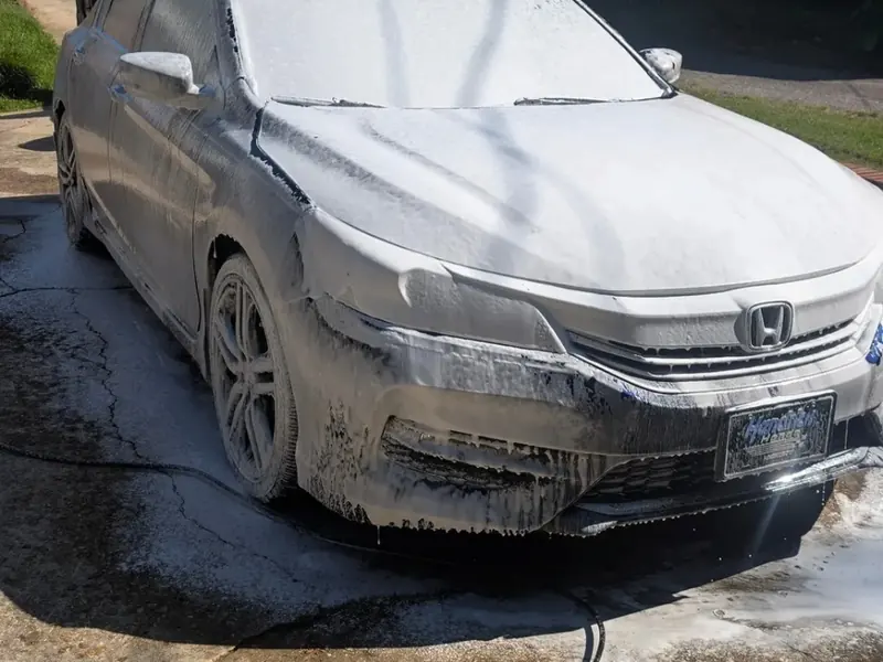 Honda sedan covered in foam during a mobile hand wash