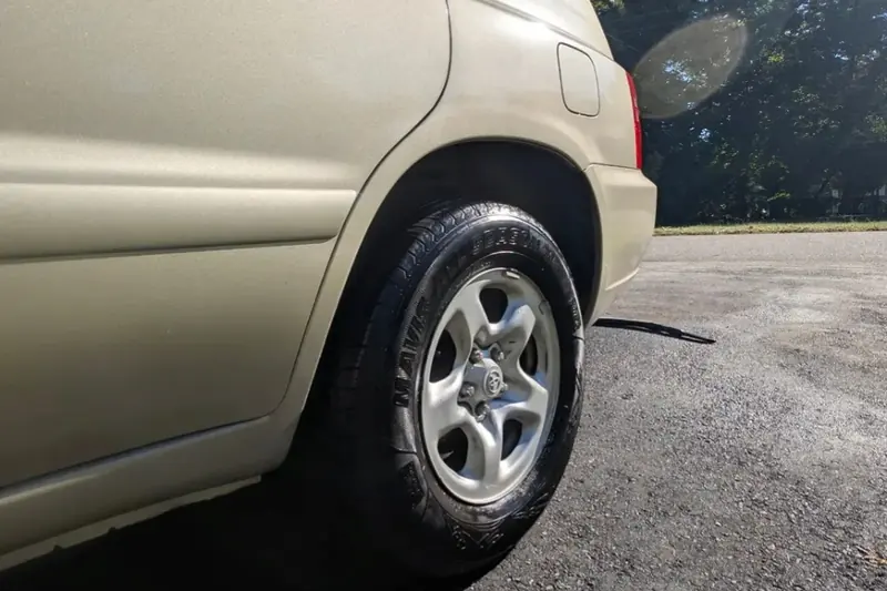 Clean tire and alloy wheel on a gold SUV